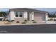 Charming single-story home with a neutral color scheme, well-maintained landscaping, and an attached two-car garage at 9532 W Parkway Dr, Tolleson, AZ 85353