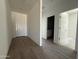Welcoming foyer with wood-look tile flooring that flows into the home's entryway at 9532 W Parkway Dr, Tolleson, AZ 85353