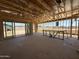 Framing of open-concept living area with patio doors and framed bar area, ready for customization and finishing touches at 9532 W Parkway Dr, Tolleson, AZ 85353