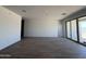Spacious living room boasts tile floors and ample natural light from sliding glass doors, perfect for entertaining at 9532 W Parkway Dr, Tolleson, AZ 85353