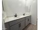 Bathroom featuring a double sink vanity with modern fixtures at 9544 W Parkway Dr, Tolleson, AZ 85353