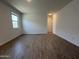 A bright bedroom with tile floors and a large window at 9544 W Parkway Dr, Tolleson, AZ 85353
