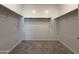 Spacious walk-in closet with carpet features ample storage with hanging rods on three sides at 9544 W Parkway Dr, Tolleson, AZ 85353
