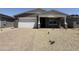 New single-story home features a two-car garage and welcoming front porch at 9544 W Parkway Dr, Tolleson, AZ 85353