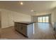 Spacious kitchen island features gray cabinets, quartz countertop and open-concept design at 9544 W Parkway Dr, Tolleson, AZ 85353