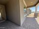 Covered patio showcasing brick pavers and a view of neighboring houses at 9544 W Parkway Dr, Tolleson, AZ 85353