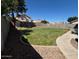 Large backyard with a well-maintained lawn and rock landscaping at 970 W Leah Ln, Gilbert, AZ 85233