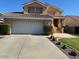 Two-story home with a two-car garage, well-manicured lawn, and traditional desert landscaping at 970 W Leah Ln, Gilbert, AZ 85233