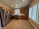Bright kitchen with stainless steel appliances, wood cabinets, and lots of counterspace at 970 W Leah Ln, Gilbert, AZ 85233