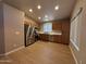 Bright kitchen featuring stainless steel appliances, wood cabinets, and wood floors at 970 W Leah Ln, Gilbert, AZ 85233