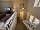 Spacious staircase with white railing, leading to an open living area and front door at 970 W Leah Ln, Gilbert, AZ 85233
