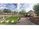 A scenic community park offers activities like cornhole, picnic areas, benches, and walking paths for residents to enjoy at 9963 W Verde Ln, Avondale, AZ 85392