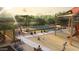 A vibrant community playground featuring covered picnic areas, slides, and a sand play area for neighborhood families at 9963 W Verde Ln, Avondale, AZ 85392