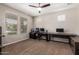Bedroom featuring a ceiling fan and carpet flooring with a large desk area at 10221 E Wavelength Ave, Mesa, AZ 85212