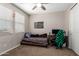 Cozy bedroom with a twin-sized bed, large window and desk with computer at 10221 E Wavelength Ave, Mesa, AZ 85212