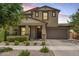 Charming two-story home featuring a well-manicured lawn and a neutral color palette at 10221 E Wavelength Ave, Mesa, AZ 85212