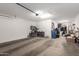 Spacious garage with ample storage, bike rack and a clean concrete floor at 10221 E Wavelength Ave, Mesa, AZ 85212