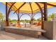 Community gazebo with seating, offering a relaxing spot for residents to gather and socialize outdoors at 10221 E Wavelength Ave, Mesa, AZ 85212