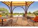 Community gazebo with shaded seating, providing a comfortable space to relax and socialize outdoors at 10221 E Wavelength Ave, Mesa, AZ 85212