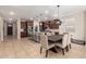 Spacious kitchen with granite countertops, stainless steel appliances, and an island with bar seating at 10221 E Wavelength Ave, Mesa, AZ 85212