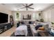 Relaxing living room with neutral tones, a plush sectional sofa, and stylish decor at 10221 E Wavelength Ave, Mesa, AZ 85212