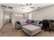 Upstairs loft area featuring a large sectional sofa and a neutral color palette at 10221 E Wavelength Ave, Mesa, AZ 85212