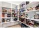 Organized walk-in pantry with ample shelving for storing groceries and kitchen essentials at 10221 E Wavelength Ave, Mesa, AZ 85212