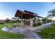 Community park featuring a shaded picnic area with tables and chairs at 10221 E Wavelength Ave, Mesa, AZ 85212