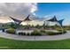 Community playground area with shade sails, play equipment, and lush landscaping at 10221 E Wavelength Ave, Mesa, AZ 85212