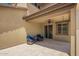 Relaxing covered patio with tiled floor, ceiling fan, and sliding glass door at 10221 E Wavelength Ave, Mesa, AZ 85212