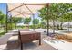 Shaded picnic area with large table and seating, perfect for outdoor gatherings and community events at 10221 E Wavelength Ave, Mesa, AZ 85212