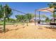 Neighborhood playground featuring swings, shade, and wood chip ground cover for safety and fun at 10221 E Wavelength Ave, Mesa, AZ 85212