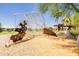 Community playground featuring a unique climbing structure, set on a soft, wood-chip surface for safety at 10221 E Wavelength Ave, Mesa, AZ 85212