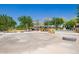 Community splash pad featuring shaded seating and open space for children to play and cool off at 10221 E Wavelength Ave, Mesa, AZ 85212