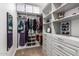 Well-organized walk-in closet with shelves, drawers, and ample storage space at 10221 E Wavelength Ave, Mesa, AZ 85212