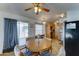 Cozy dining area with a round table and view of the kitchen and backyard access at 111 S Greenfield Rd # 244, Mesa, AZ 85206