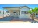 Charming manufactured home with covered parking, desert landscaping and delightful curb appeal at 111 S Greenfield Rd # 244, Mesa, AZ 85206