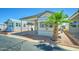 Well-maintained manufactured home with carport, desert landscaping, and lovely curb appeal at 111 S Greenfield Rd # 244, Mesa, AZ 85206