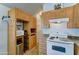 Well-equipped kitchen with built-in storage and appliances, maximizing space at 111 S Greenfield Rd # 244, Mesa, AZ 85206