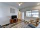 Comfortable living room featuring vinyl floors, bright light, and a neutral color scheme at 111 S Greenfield Rd # 244, Mesa, AZ 85206