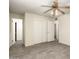Bedroom featuring tile flooring, ceiling fan, closet, and neutral wall paint at 126 N 58Th St, Mesa, AZ 85205