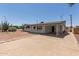 Charming single-story home with desert landscaping, carport, and cozy front porch at 126 N 58Th St, Mesa, AZ 85205
