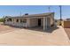 Charming single-story home with desert landscaping, carport, and cozy front porch at 126 N 58Th St, Mesa, AZ 85205