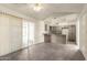 Bright kitchen featuring wood-tone cabinets, stainless steel sink, granite countertops, and tile floors at 126 N 58Th St, Mesa, AZ 85205