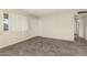 Bright room featuring stylish flooring, a window, and closet space at 126 N 58Th St, Mesa, AZ 85205