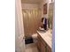 Cozy bathroom featuring vanity sink, and gold shower curtain at 12955 E Sahuaro Dr, Scottsdale, AZ 85259