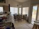 Bright dining area with a ceiling fan and a sliding glass door leading to the patio at 12955 E Sahuaro Dr, Scottsdale, AZ 85259