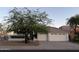 Charming single-story home with a well-maintained front yard and three-car garage at 12955 E Sahuaro Dr, Scottsdale, AZ 85259