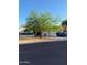 Charming single-story home with a two-car garage and mature desert landscaping at 12955 E Sahuaro Dr, Scottsdale, AZ 85259