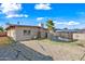 Exterior shot of backyard with pool, gravel yard, and partial fence at 1307 E Broadmor Dr, Tempe, AZ 85282